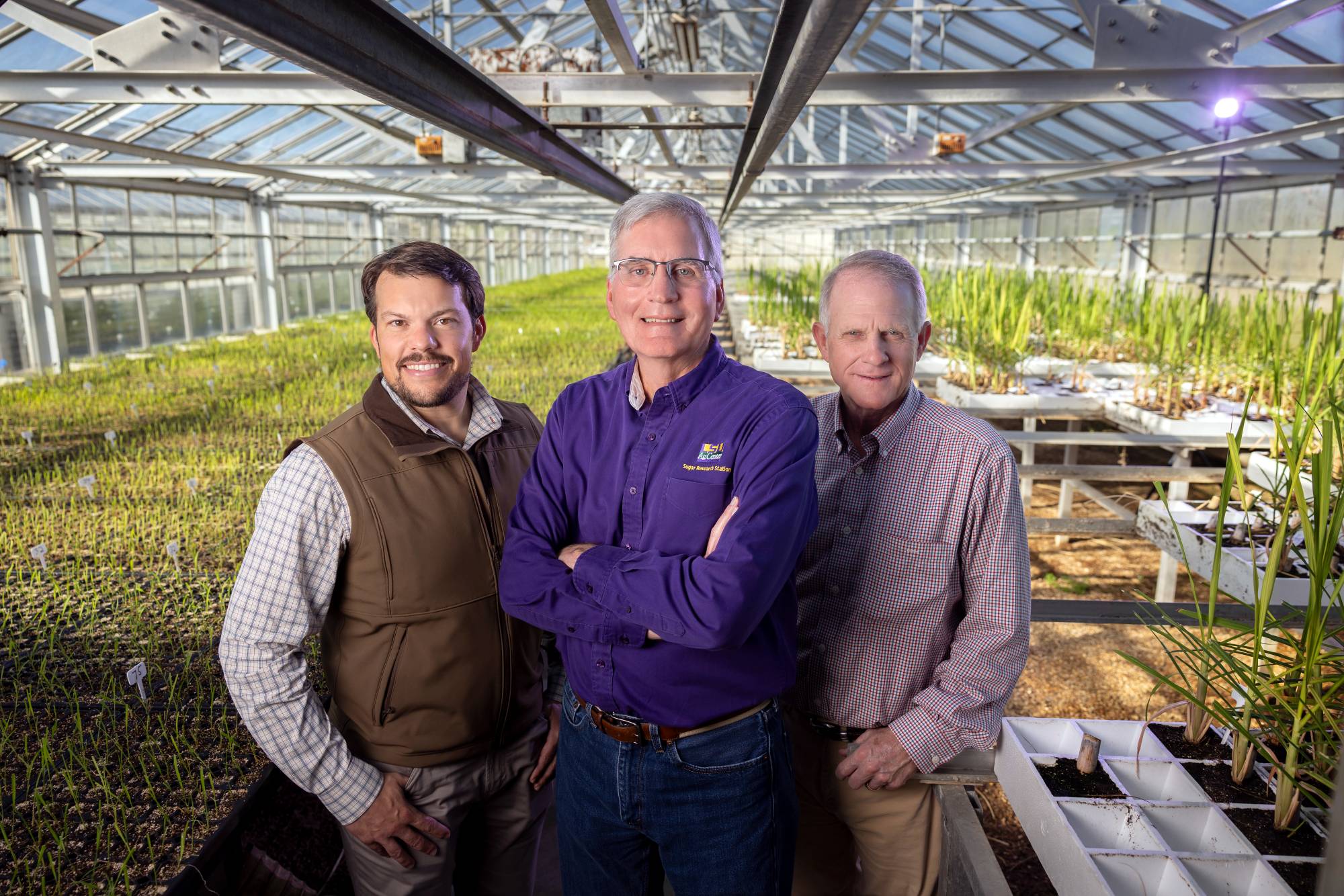 Group portrait inside greenhouse