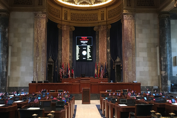 A photo of the Louisiana Capitol senate chamber, the room is empty.