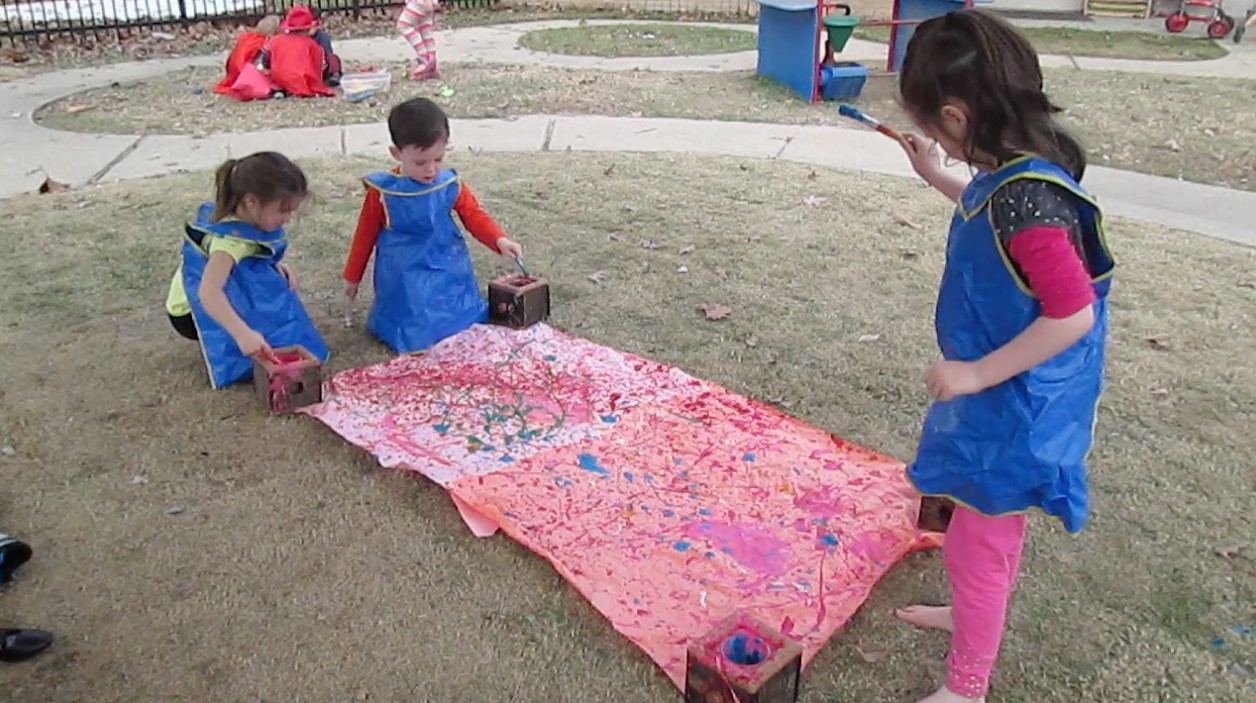 Children at LSU laboratory preschool paint.