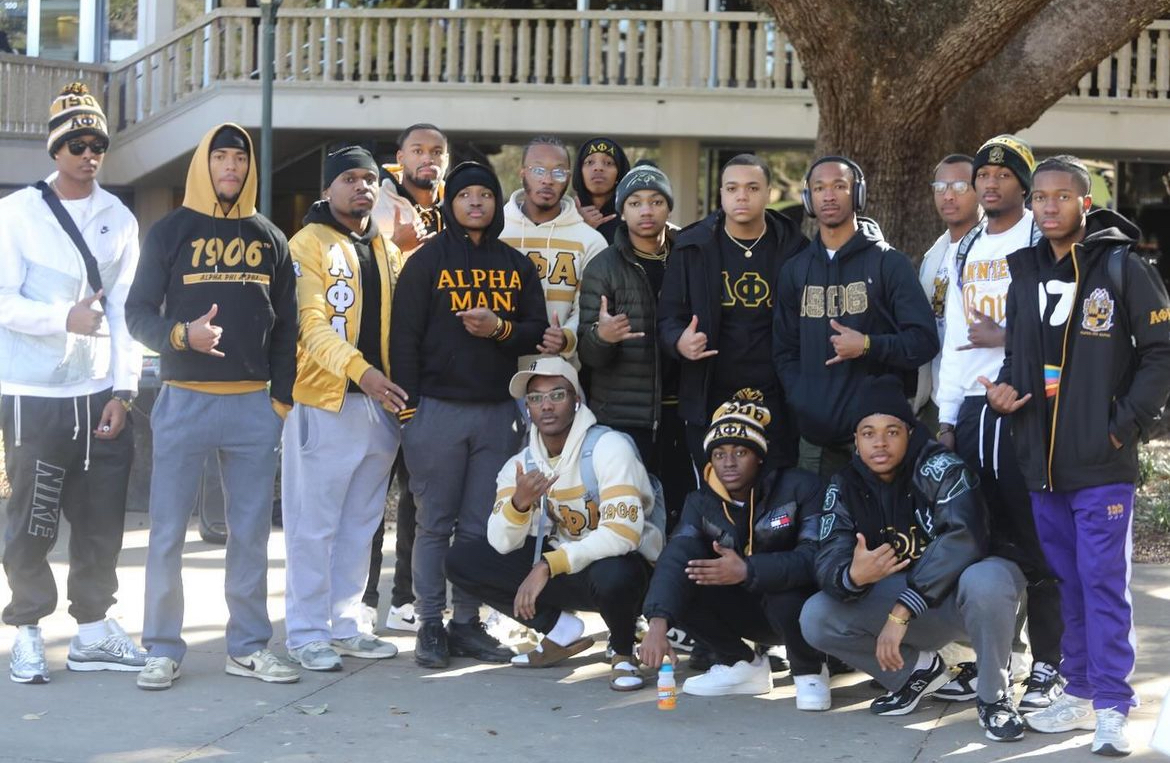 Alpha Phi Alpha members in suits