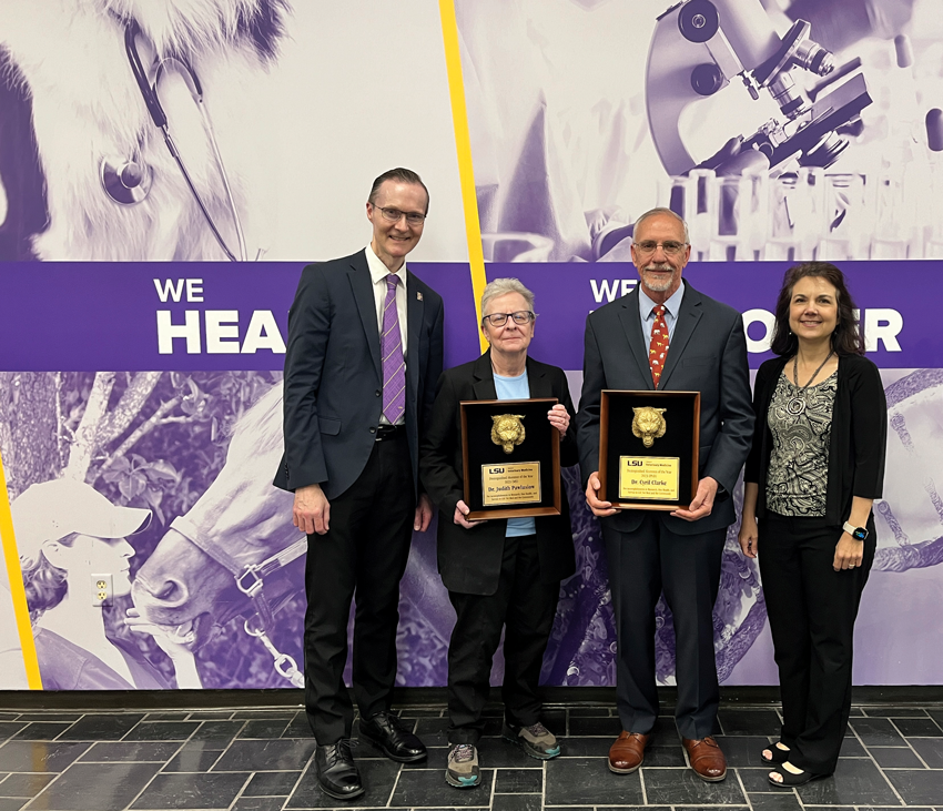 Dean Oliver Garden (left) and Associate Dean for Research and Graduate Education Tammy Dugas (right) congratulate Distinguished Alumnus Award recipients Dr. Judy Pawlusiow and Dr. Cyril Clarke.